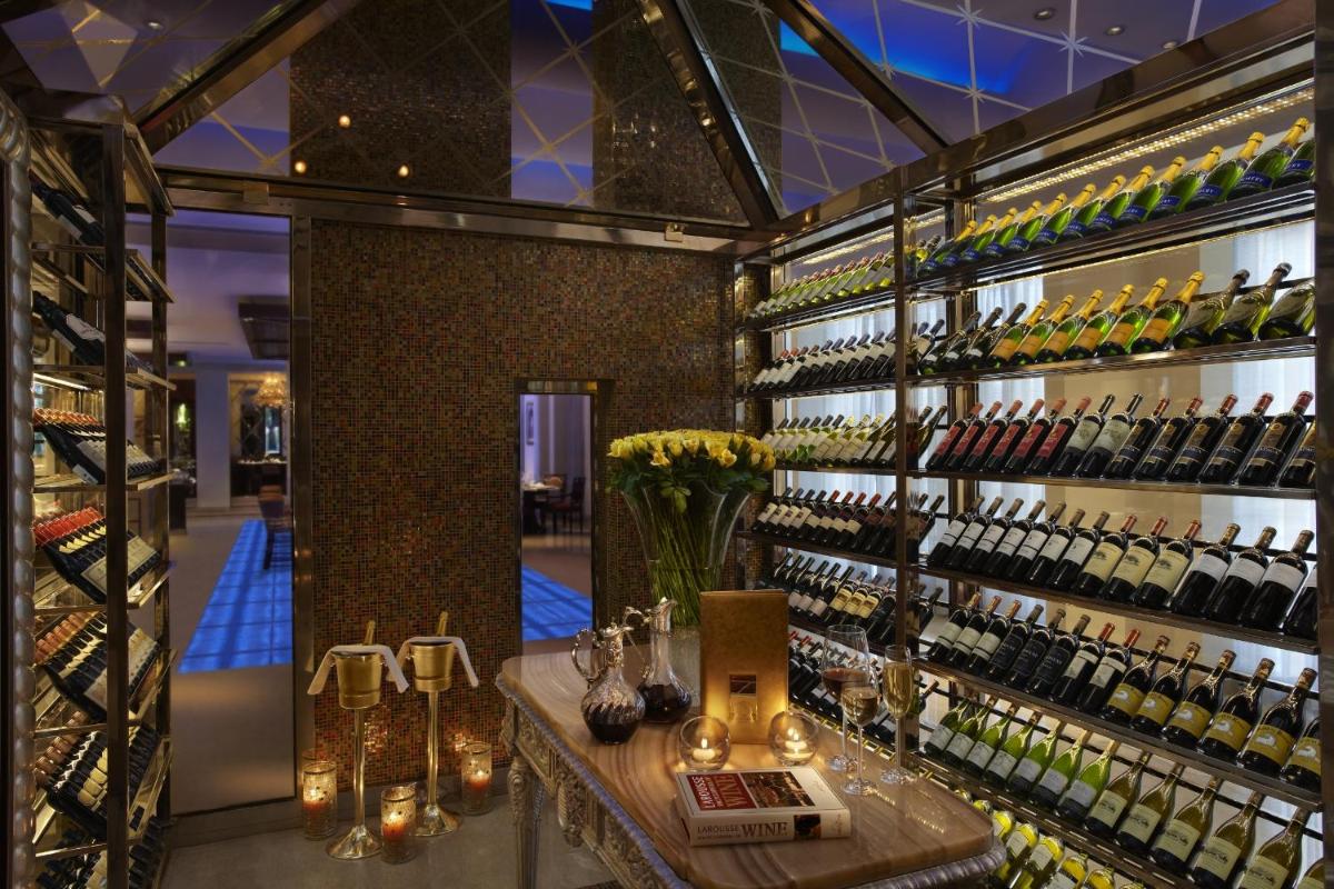 a wine store with a display of wine bottles at The Leela Palace Udaipur in Udaipur