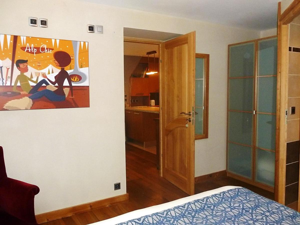 Un ou plusieurs lits dans un hébergement de l'établissement Aiguille du Midi - Hôtel & Restaurant