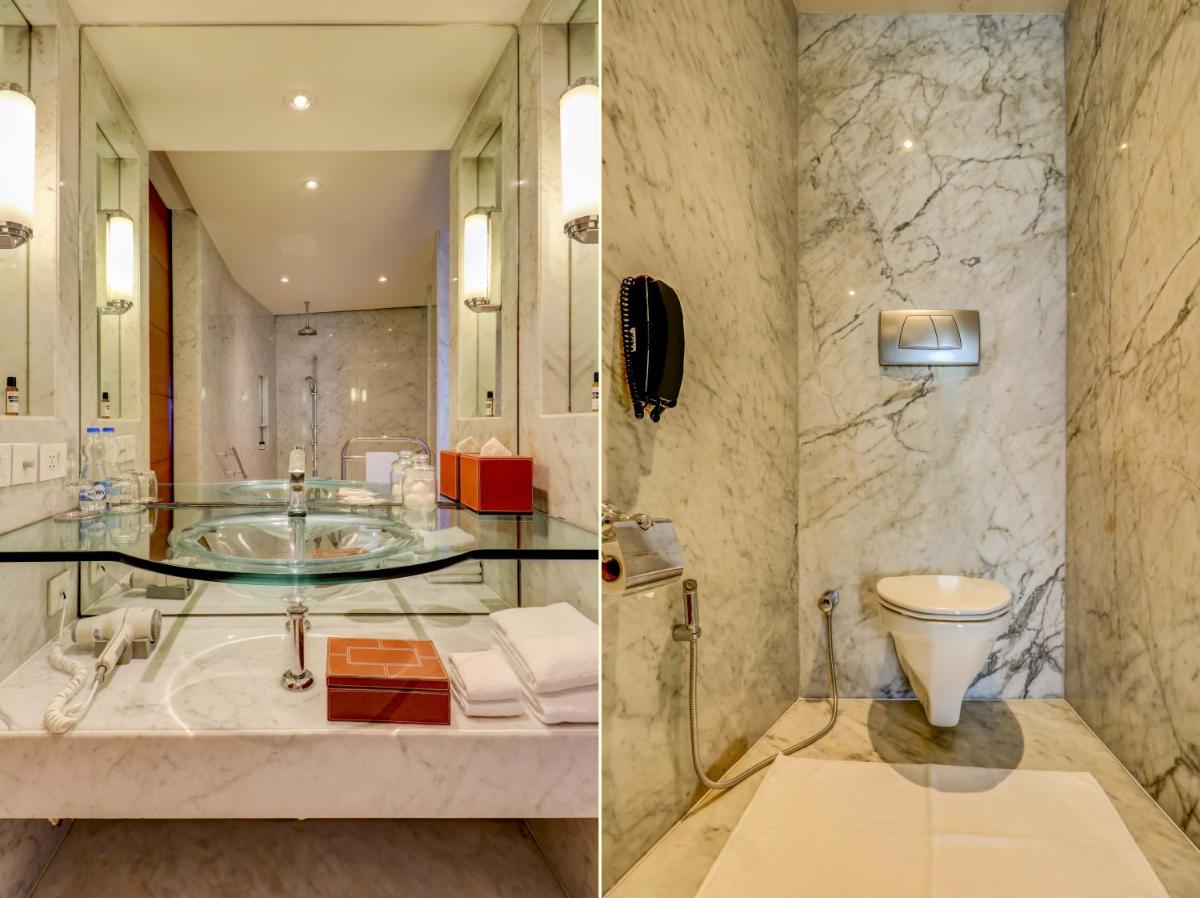 a bathroom with a sink and a toilet at Hyatt Regency Kolkata in Kolkata a bathroom with a sink and a toilet at Hyatt Regency Kolkata in Kolkata