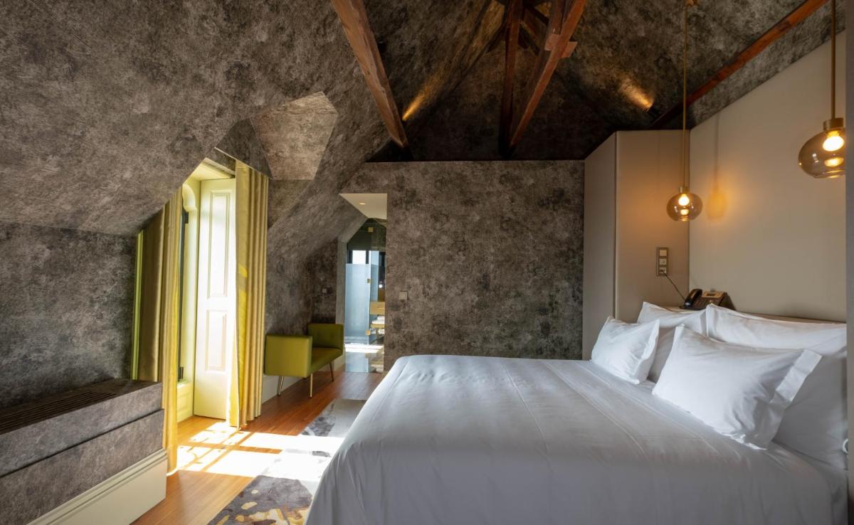 Uma cama ou camas num quarto em Vila Foz Hotel & SPA - member of Design Hotels