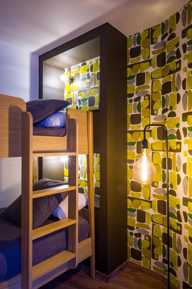 Un ou plusieurs lits dans un hébergement de l'établissement L'Outa Hotel Restaurant