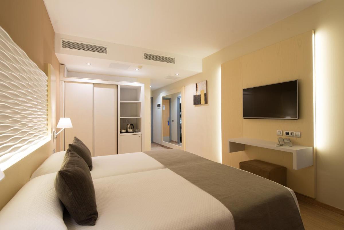 Cama o camas de una habitación en HL Suitehotel Playa del Inglés - Adults Only
