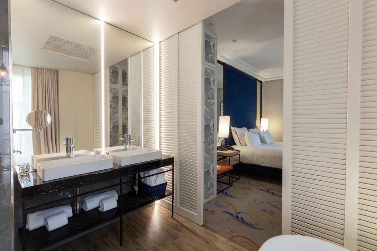 Cama o camas de una habitación en Pestana Collection Plaza Mayor