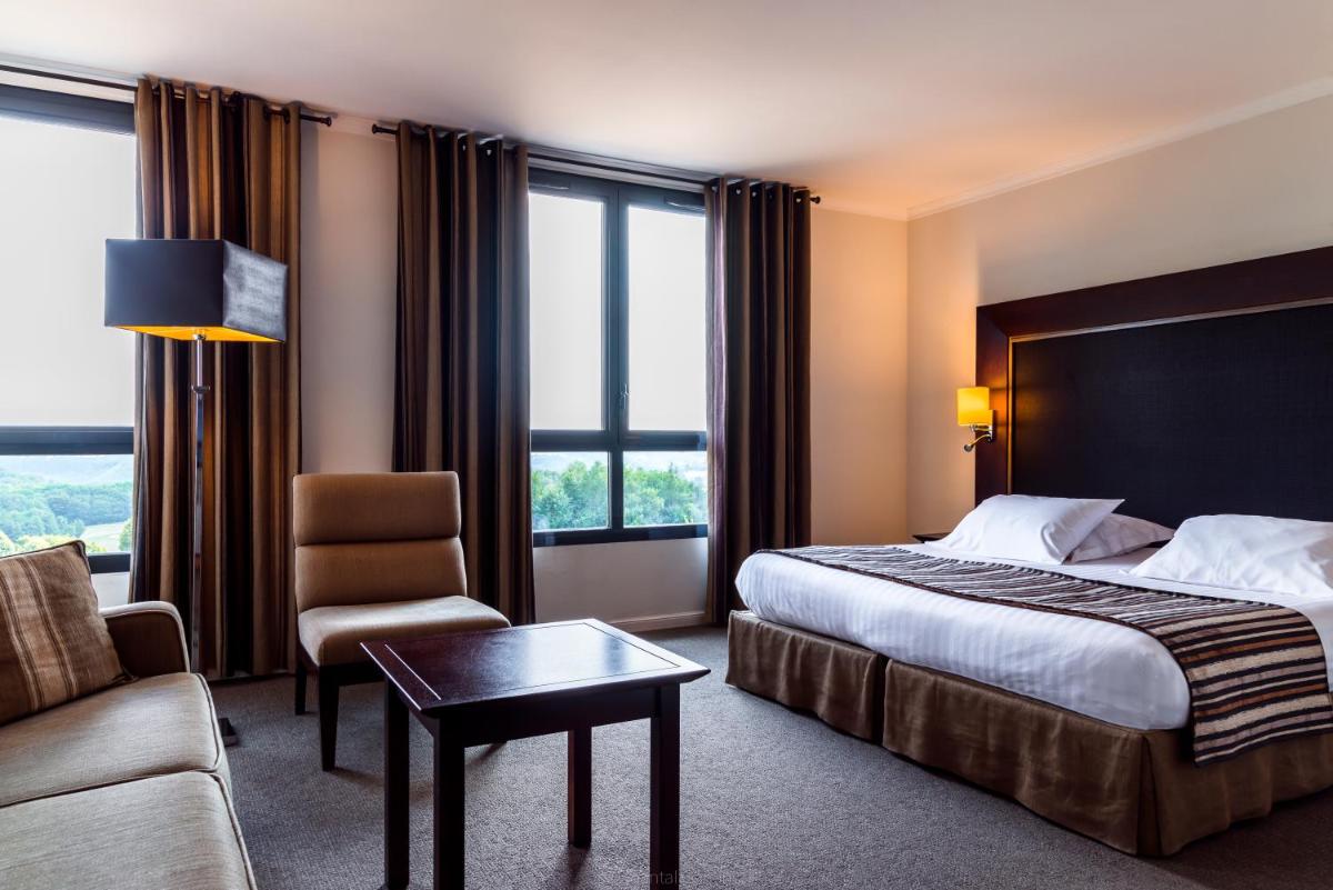 Un ou plusieurs lits dans un hébergement de l'établissement Hôtel du Golf
