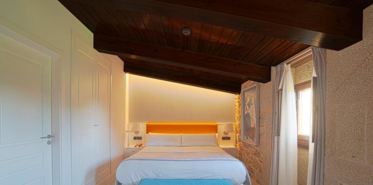 Cama o camas de una habitación en Hotel As Torres da Hermida