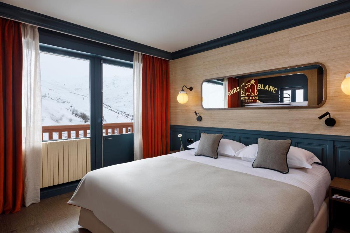 Un ou plusieurs lits dans un hébergement de l'établissement Ours Blanc Hotel & Spa