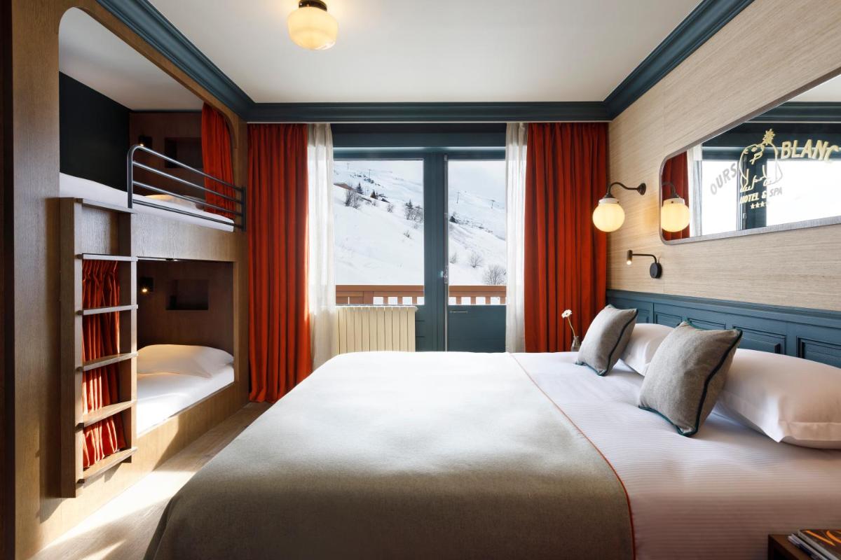 Un ou plusieurs lits dans un hébergement de l'établissement Ours Blanc Hotel & Spa