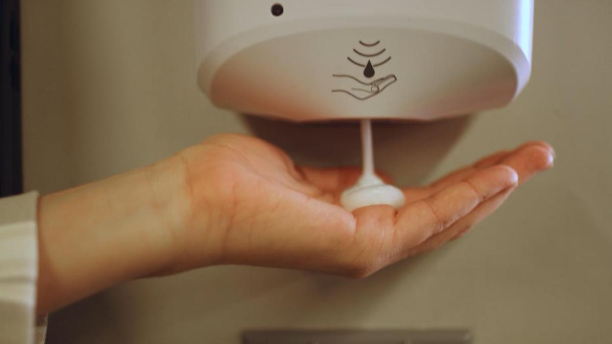 a hand is holding a blow dryer at Holiday Inn Mumbai International Airport by IHG in Mumbai