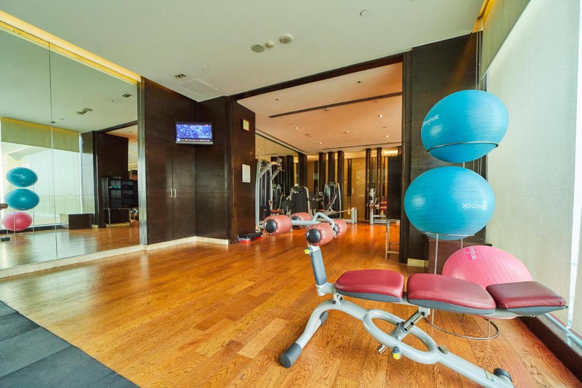 a gym with two exercise chairs in a room at Crowne Plaza New Delhi Rohini by IHG in New Delhi a gym with two exercise chairs in a room at Crowne Plaza New Delhi Rohini by IHG in New Delhi