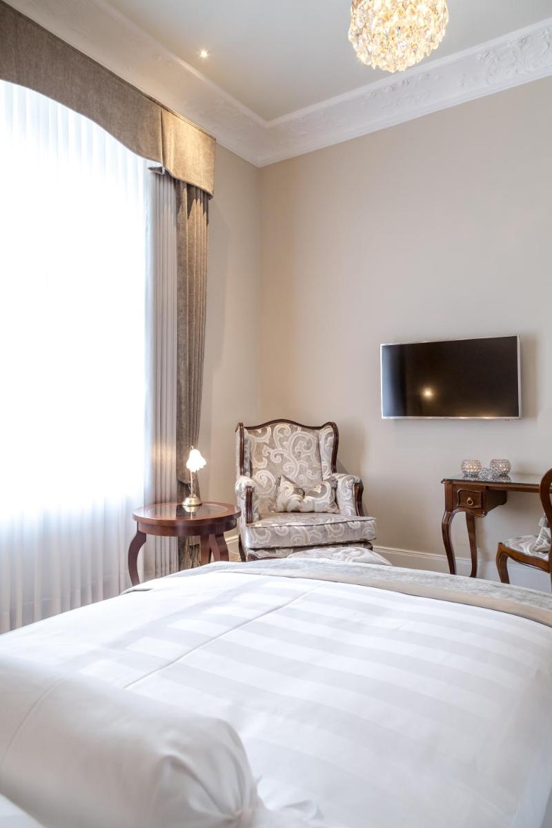 Ein Bett oder Betten in einem Zimmer der Unterkunft Hotel Miramar