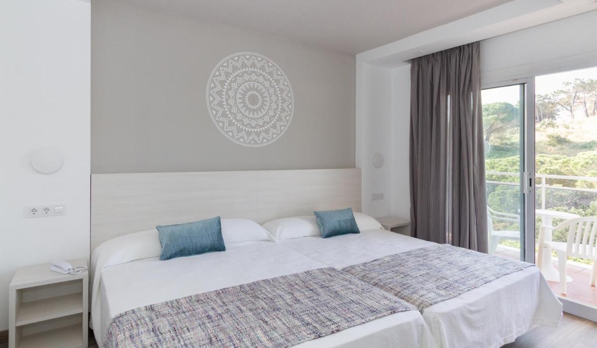Cama o camas de una habitación en Hotel Oasis Park Splash