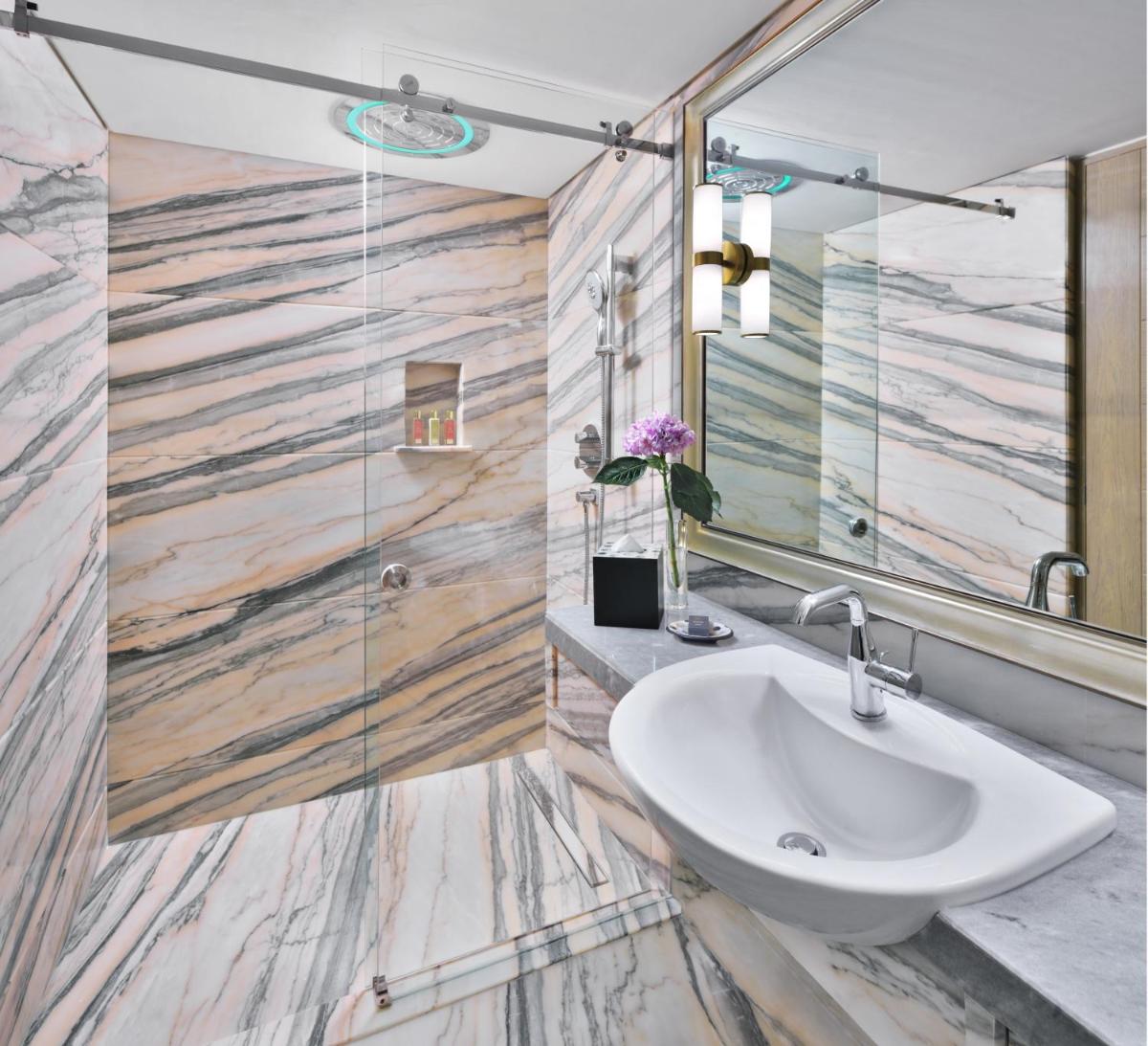 a bathroom with a sink and a mirror at Taj Mahal, New Delhi in New Delhi