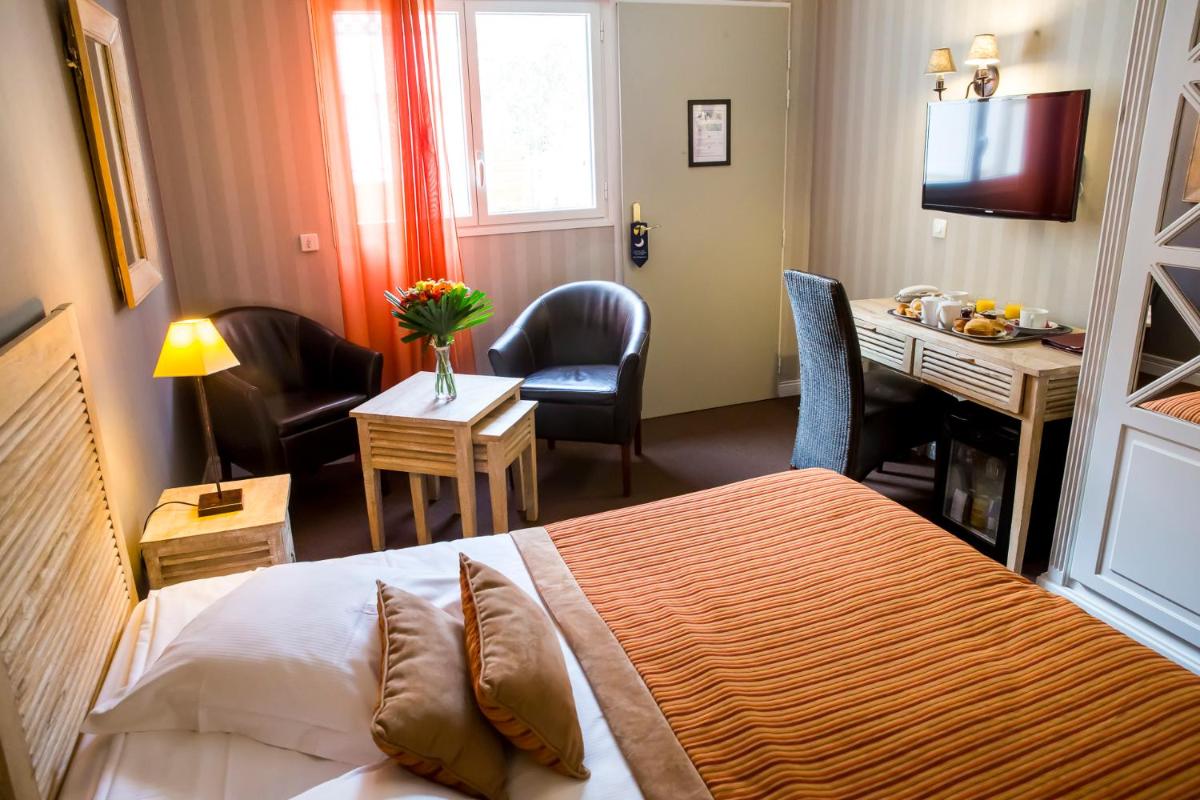 Un ou plusieurs lits dans un hébergement de l'établissement Almoria Hôtel & SPA