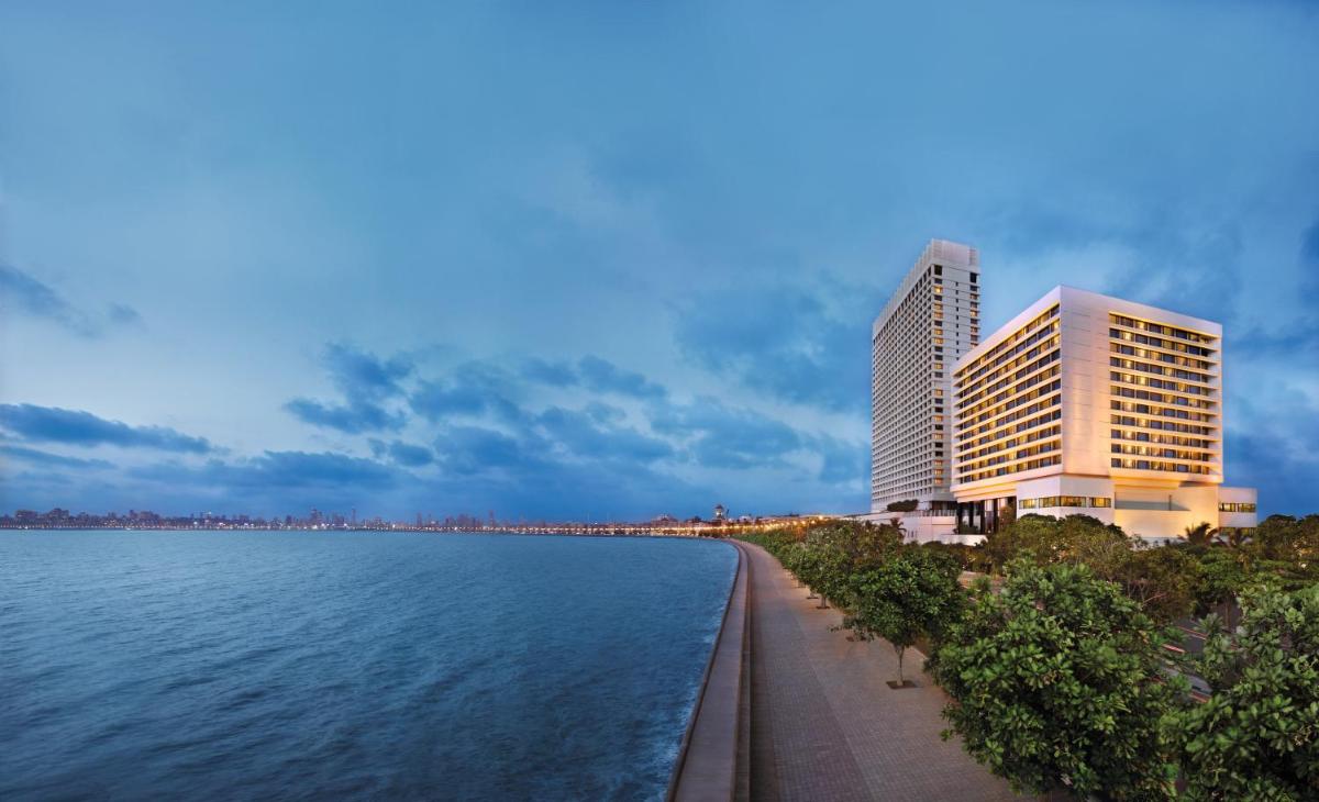 a view of a building next to a body of water at The Oberoi Mumbai in Mumbai