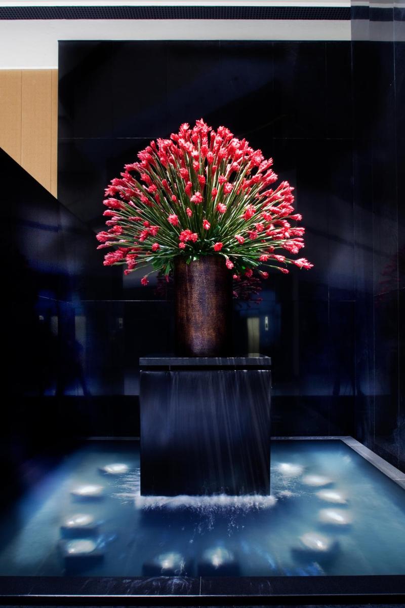 a plant in a vase on a table at The Oberoi Mumbai in Mumbai