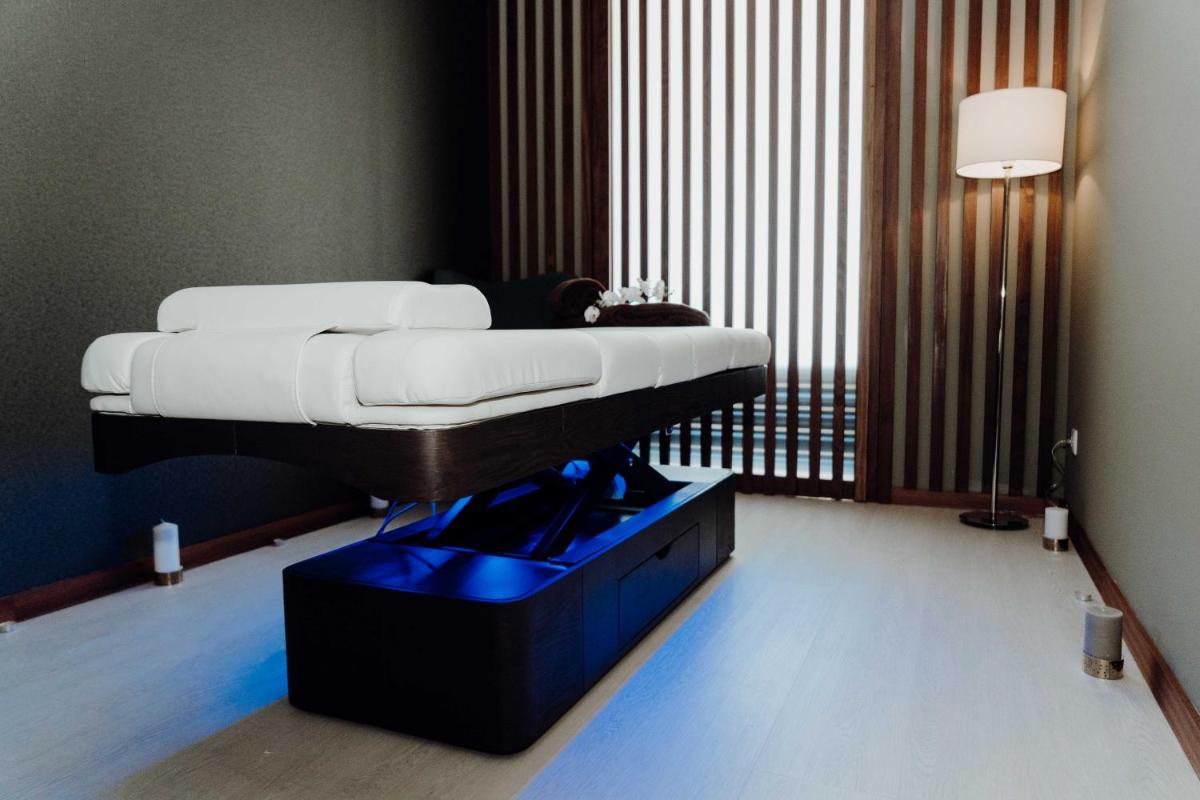 Uma cama ou camas num quarto em Hotel São Bento da Porta Aberta & Spa