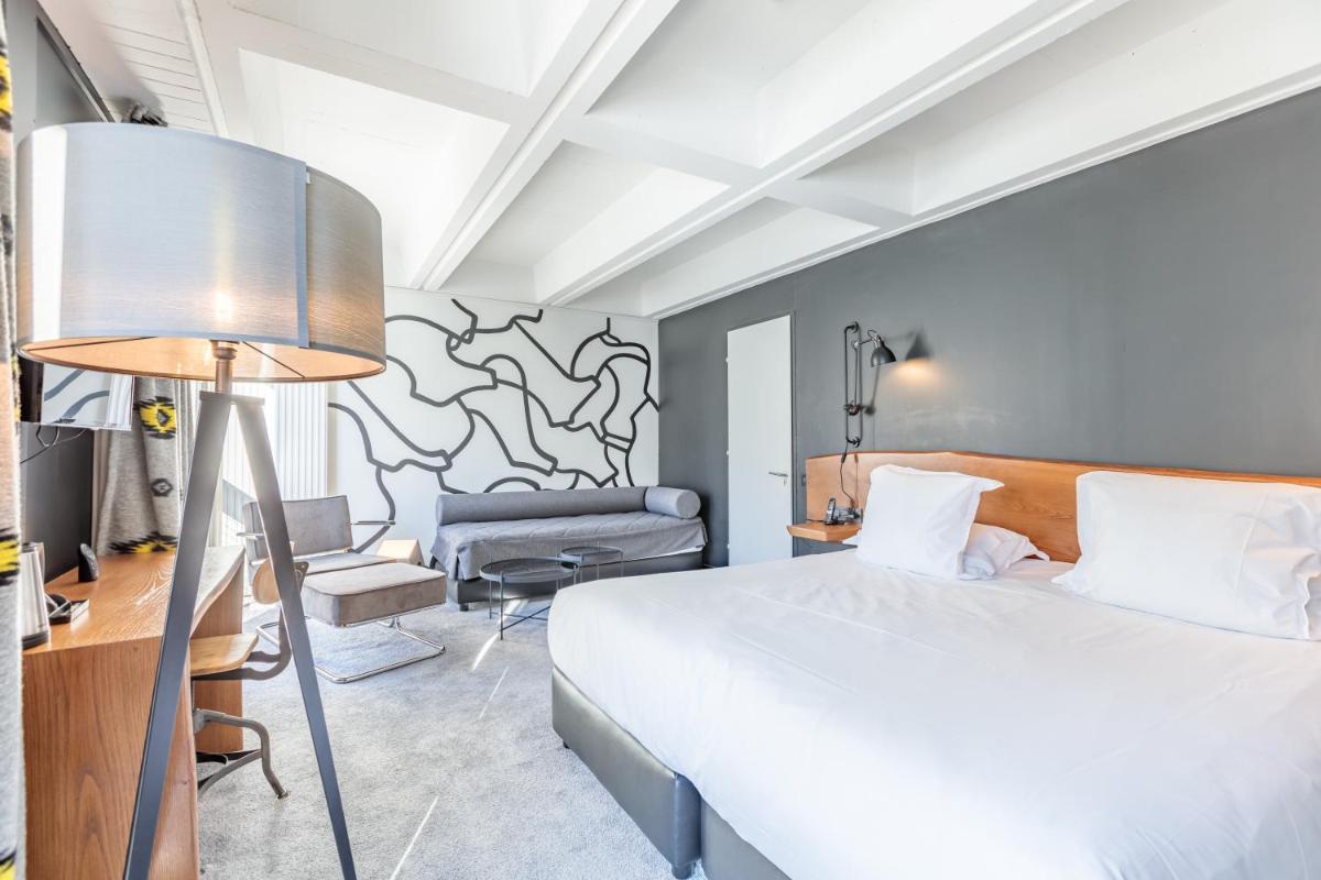 Un ou plusieurs lits dans un hébergement de l'établissement Totem, Friendly Hotel & Spa