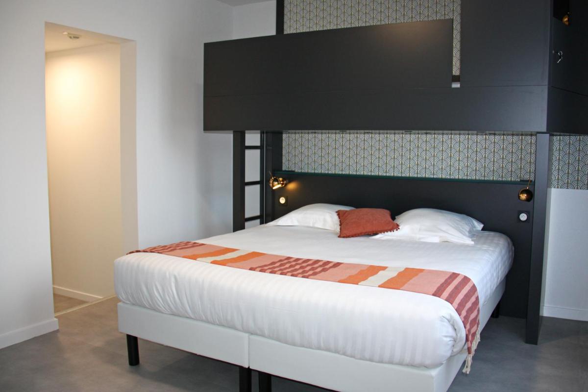 Un ou plusieurs lits dans un hébergement de l'établissement Hôtel du Parc & Spa