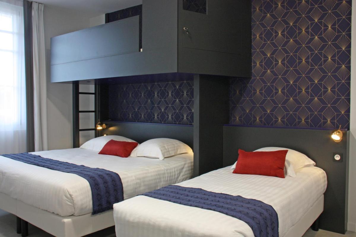 Un ou plusieurs lits dans un hébergement de l'établissement Hôtel du Parc & Spa