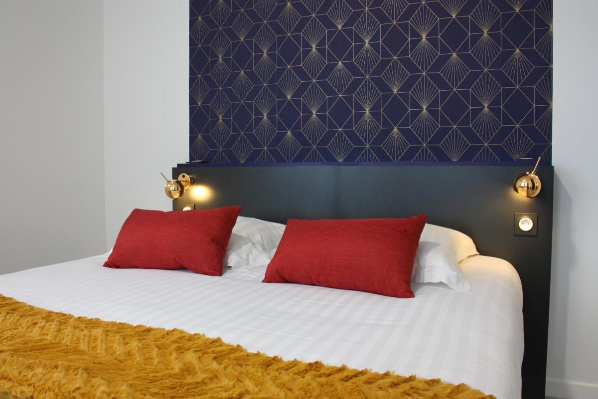 Un ou plusieurs lits dans un hébergement de l'établissement Hôtel du Parc & Spa