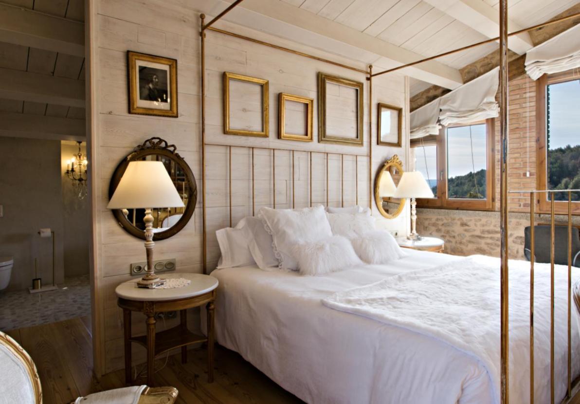 Cama o camas de una habitación en La Vella Farga Hotel