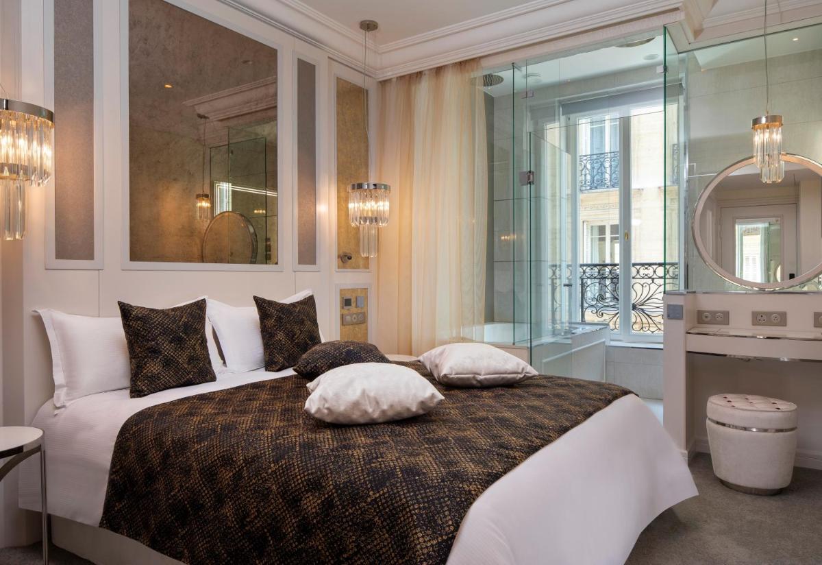 Un ou plusieurs lits dans un hébergement de l'établissement Paris j'Adore Hotel & Spa