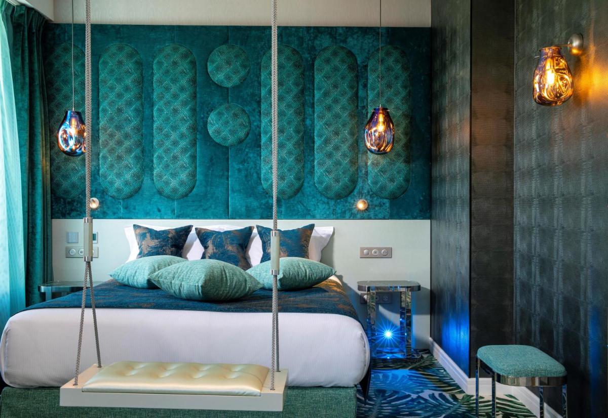 Un ou plusieurs lits dans un hébergement de l'établissement Paris j'Adore Hotel & Spa