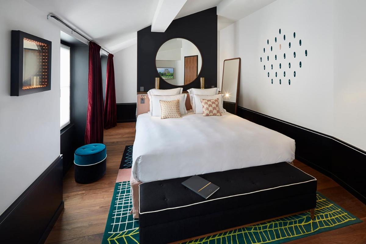 Un ou plusieurs lits dans un hébergement de l'établissement Le Roch Hotel & Spa