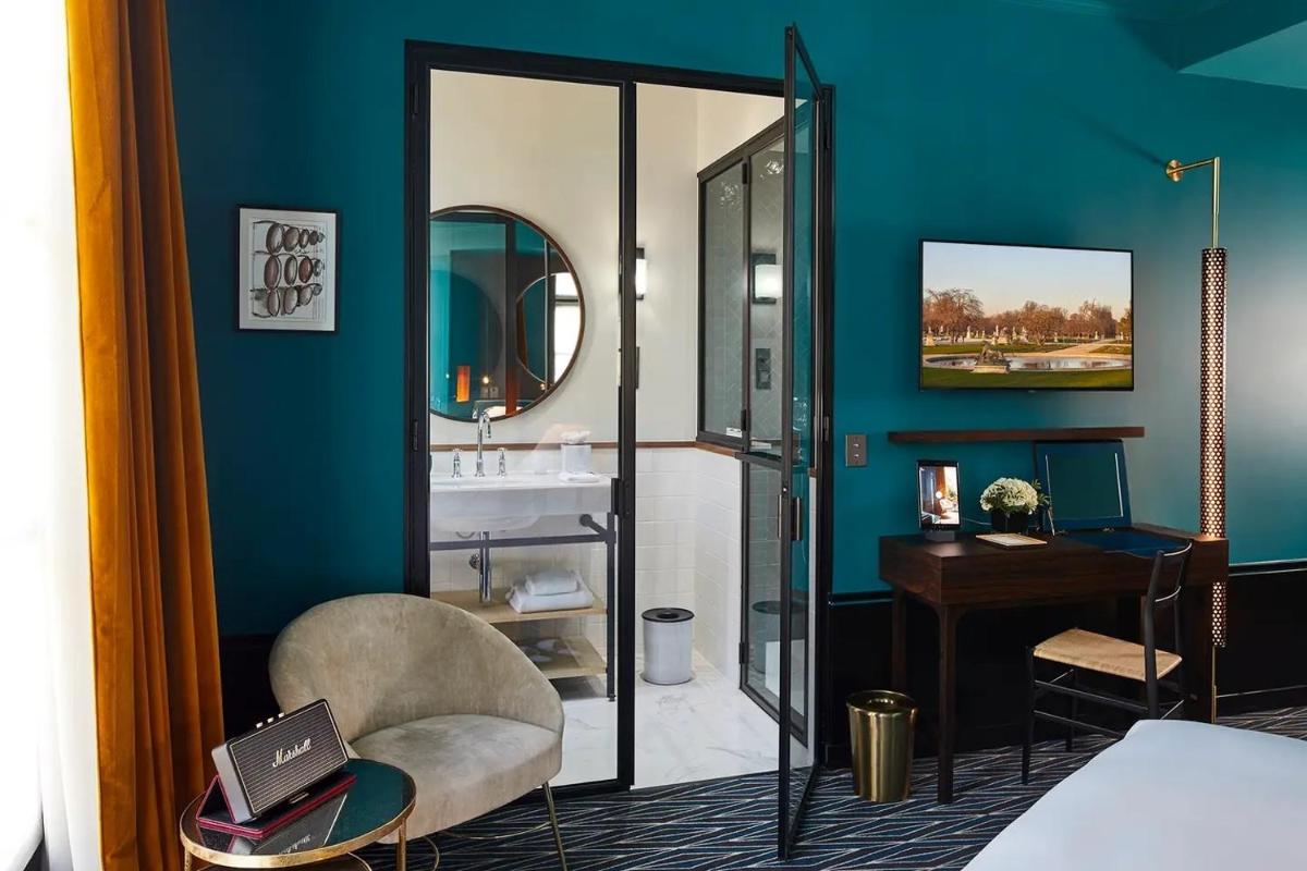 Un ou plusieurs lits dans un hébergement de l'établissement Le Roch Hotel & Spa