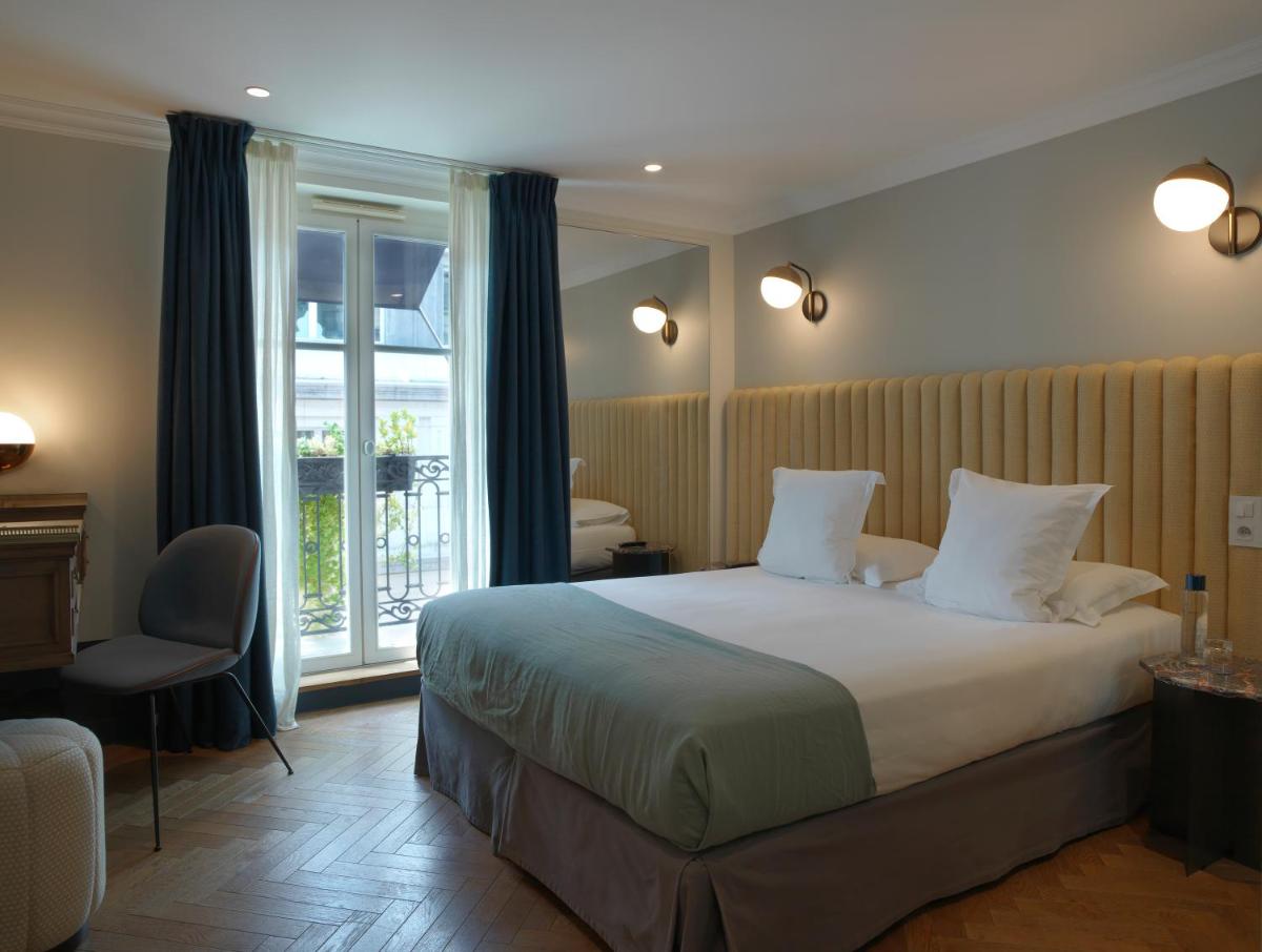 Un ou plusieurs lits dans un hébergement de l'établissement Hotel Bachaumont