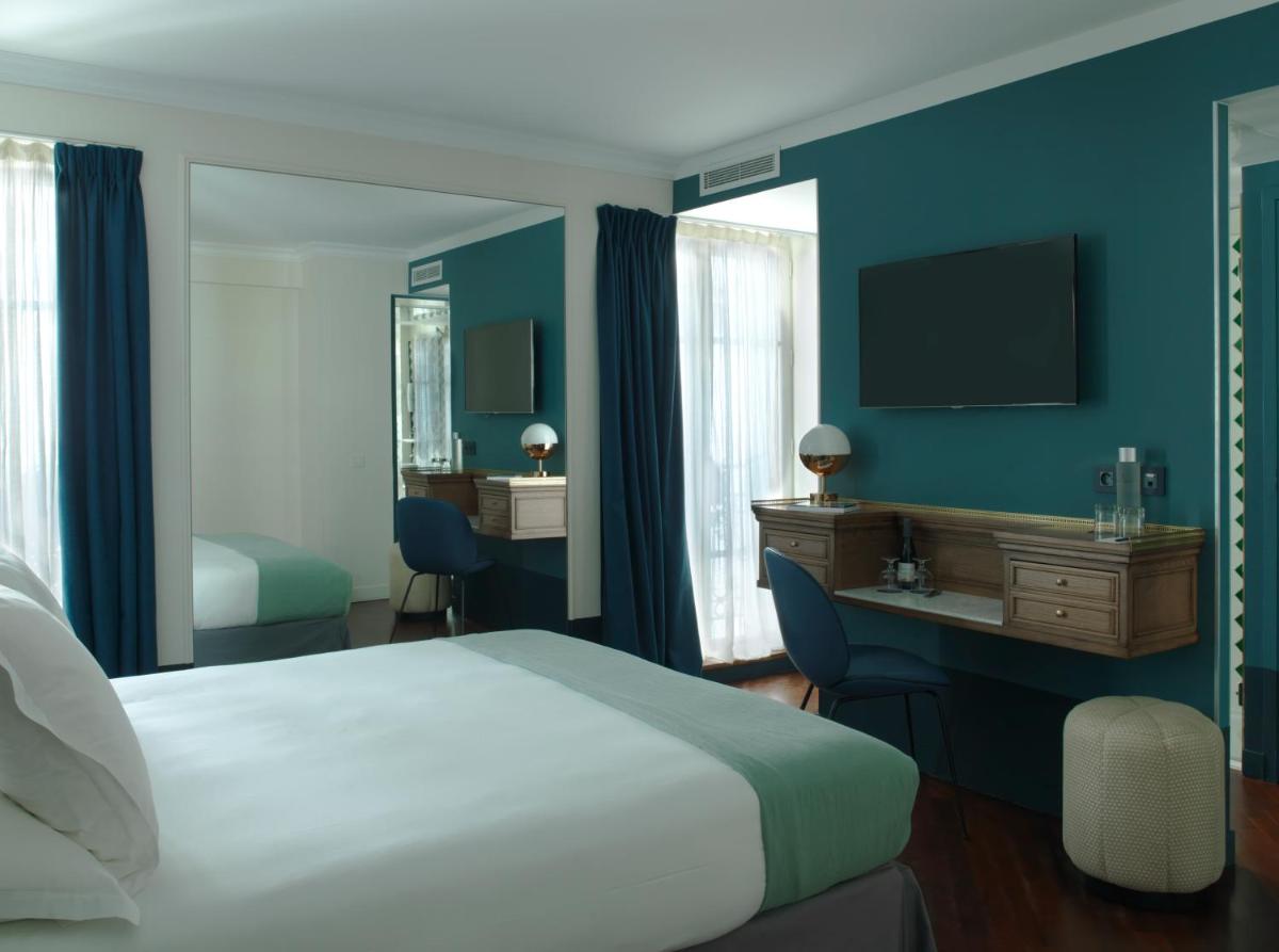 Un ou plusieurs lits dans un hébergement de l'établissement Hotel Bachaumont