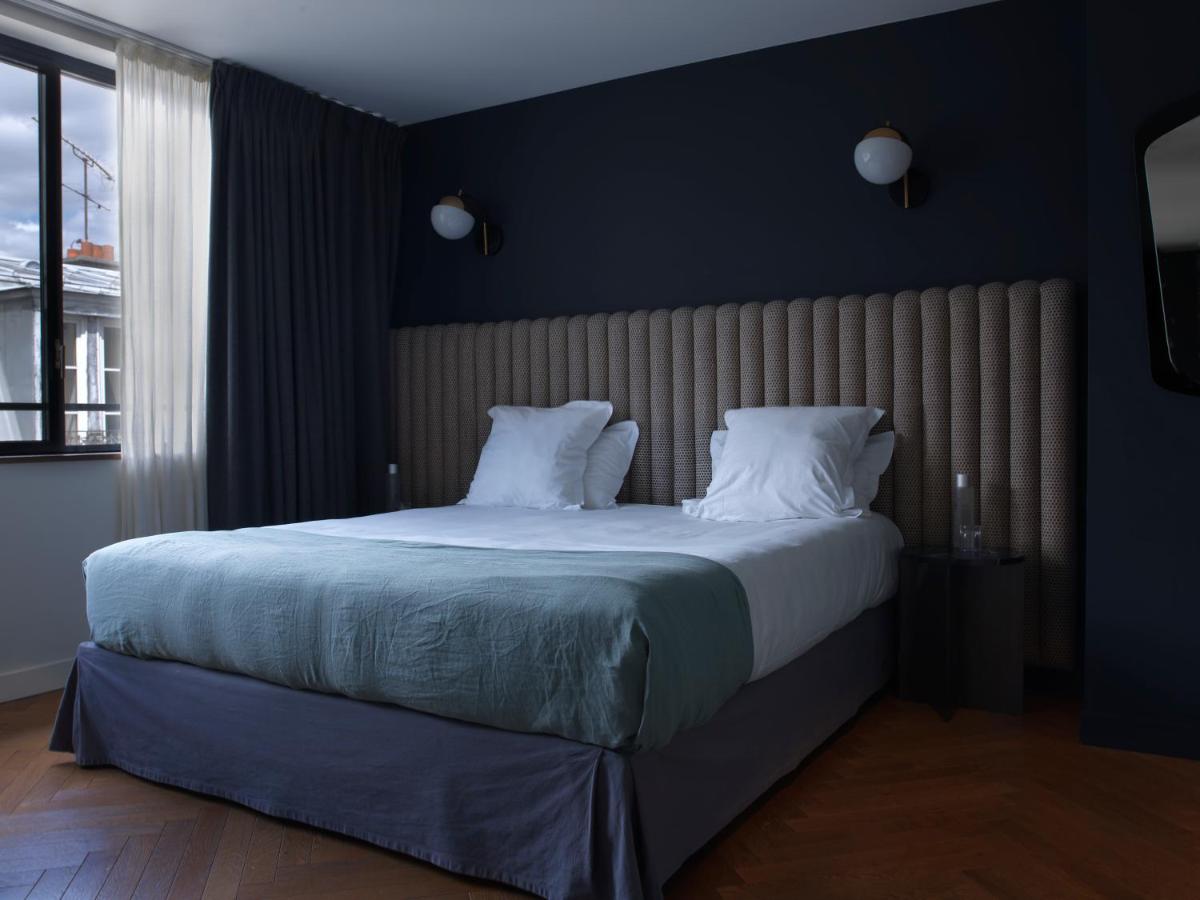 Un ou plusieurs lits dans un hébergement de l'établissement Hotel Bachaumont