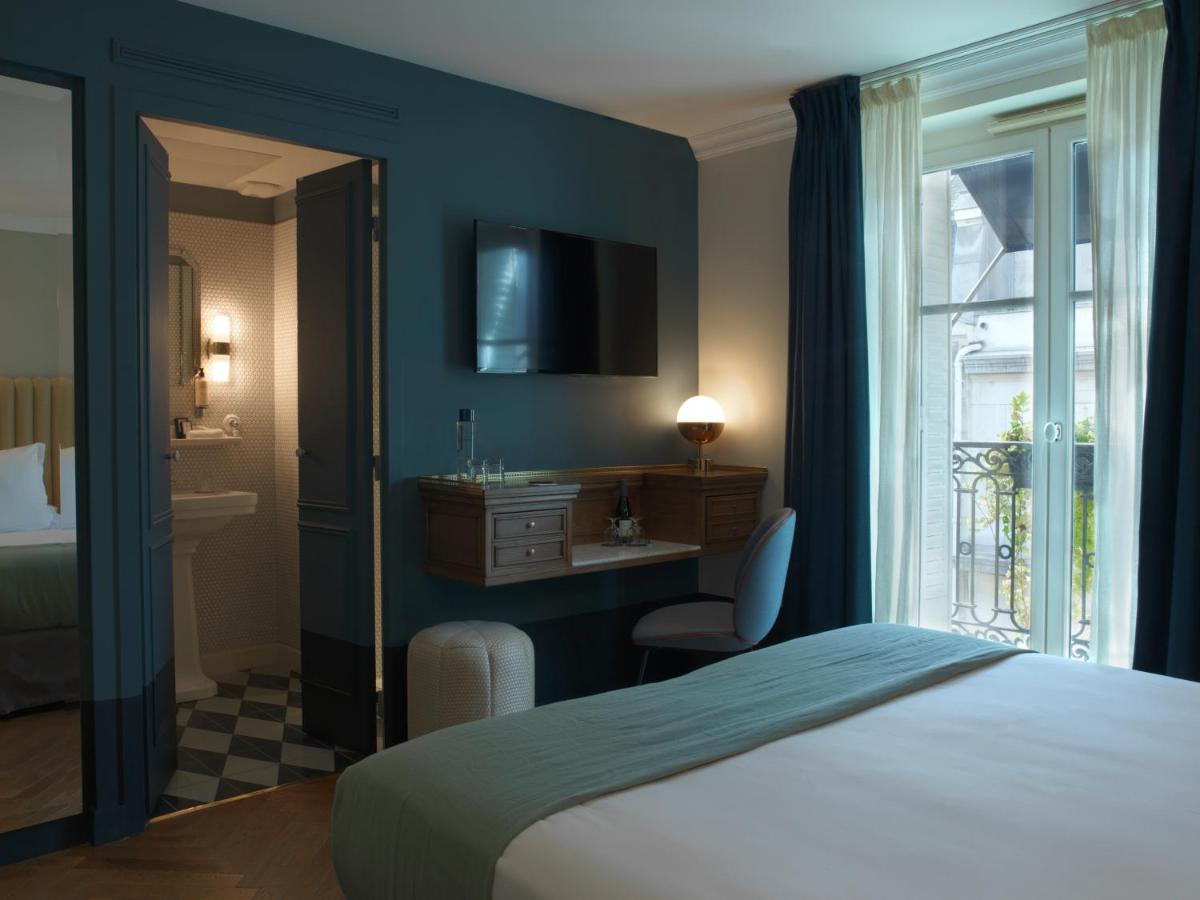 Un ou plusieurs lits dans un hébergement de l'établissement Hotel Bachaumont