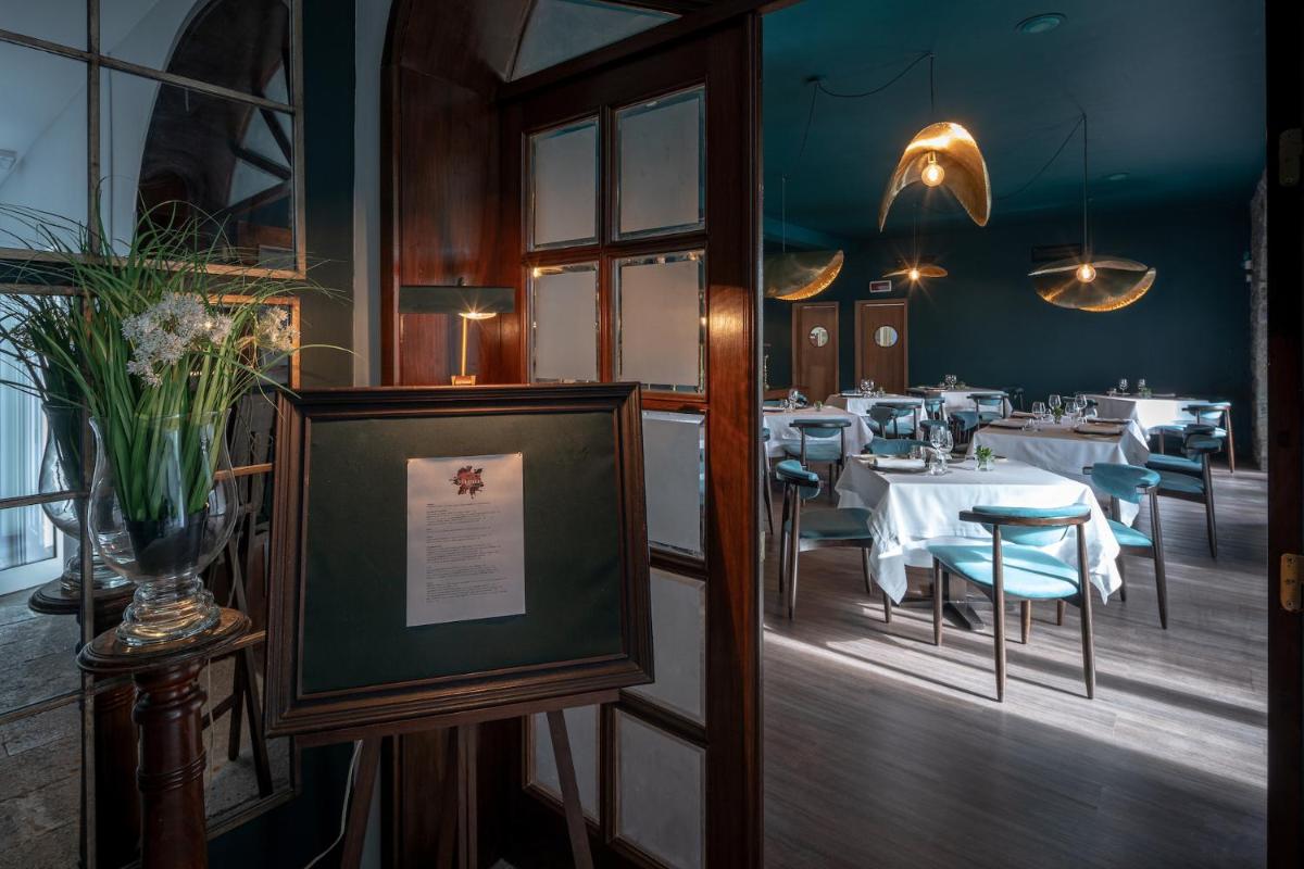 Um restaurante ou outro lugar para comer em Senhora da Rosa, Tradition & Nature Hotel
