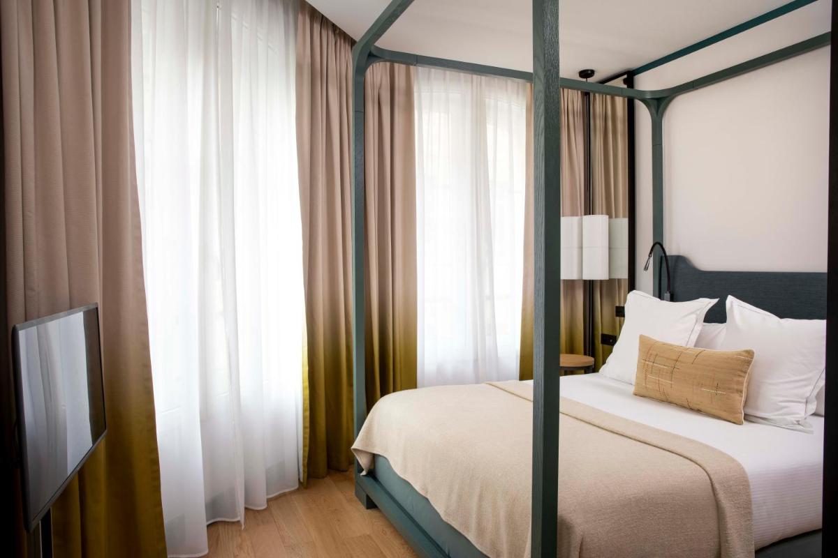 Un ou plusieurs lits dans un hébergement de l'établissement Hôtel Bel Ami