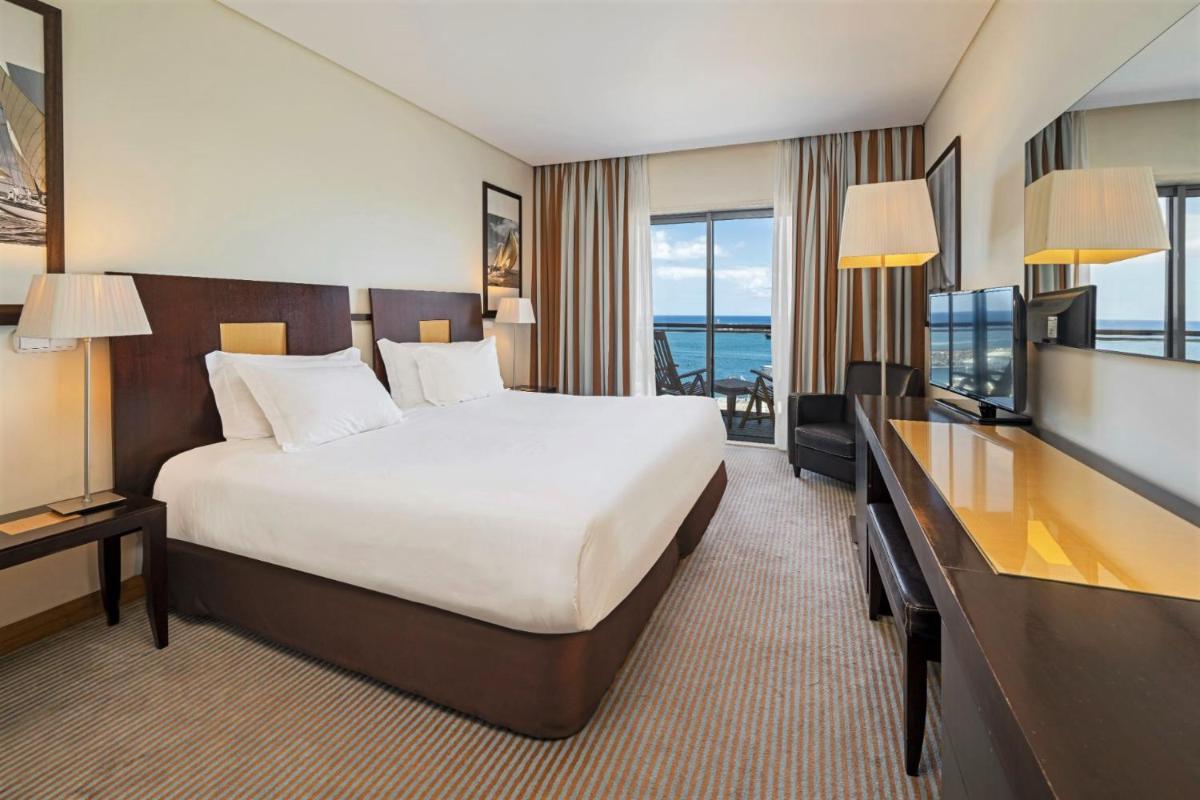 Uma cama ou camas num quarto em Hotel Marina Atlântico