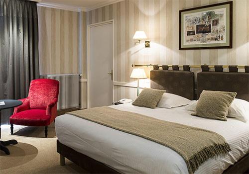 Un ou plusieurs lits dans un hébergement de l'établissement Le Grand Hotel & Spa