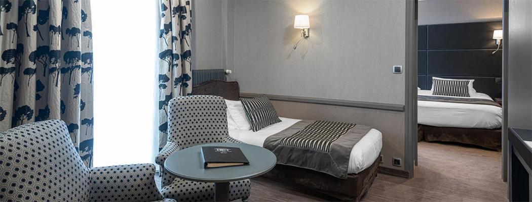 Un ou plusieurs lits dans un hébergement de l'établissement Le Grand Hotel & Spa
