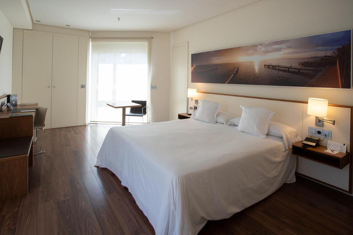 Cama o camas de una habitación en Primus Valencia