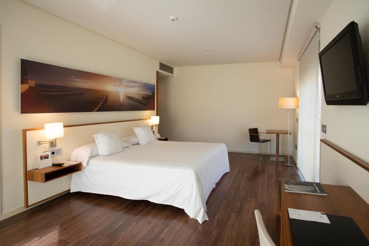 Cama o camas de una habitación en Primus Valencia
