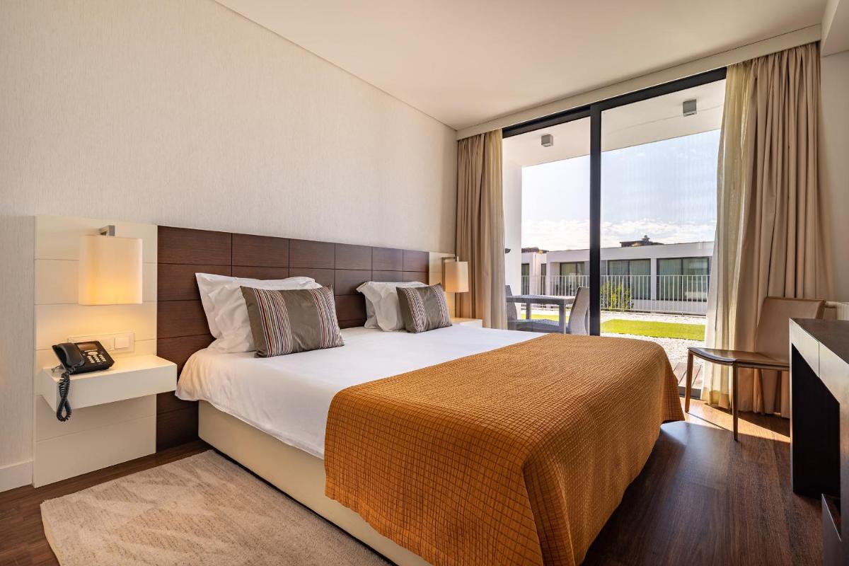 Uma cama ou camas num quarto em Monchique Resort & Spa