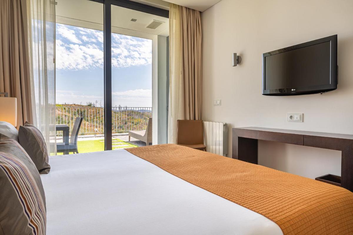Uma cama ou camas num quarto em Monchique Resort & Spa