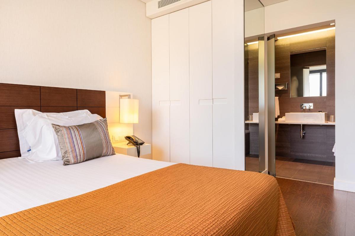 Uma cama ou camas num quarto em Monchique Resort & Spa
