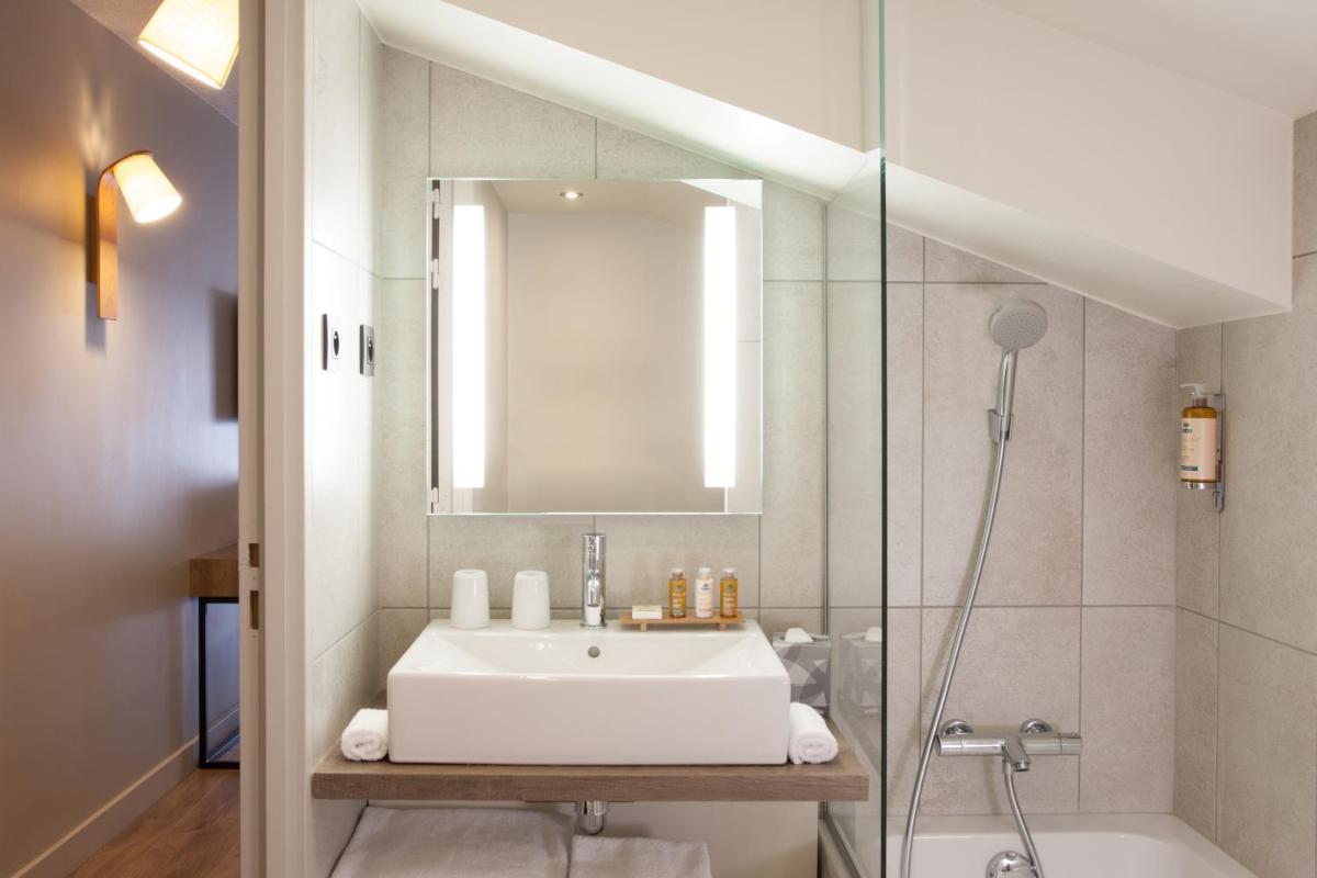 Salle de bains dans l'établissement Heliopic Hotel & Spa