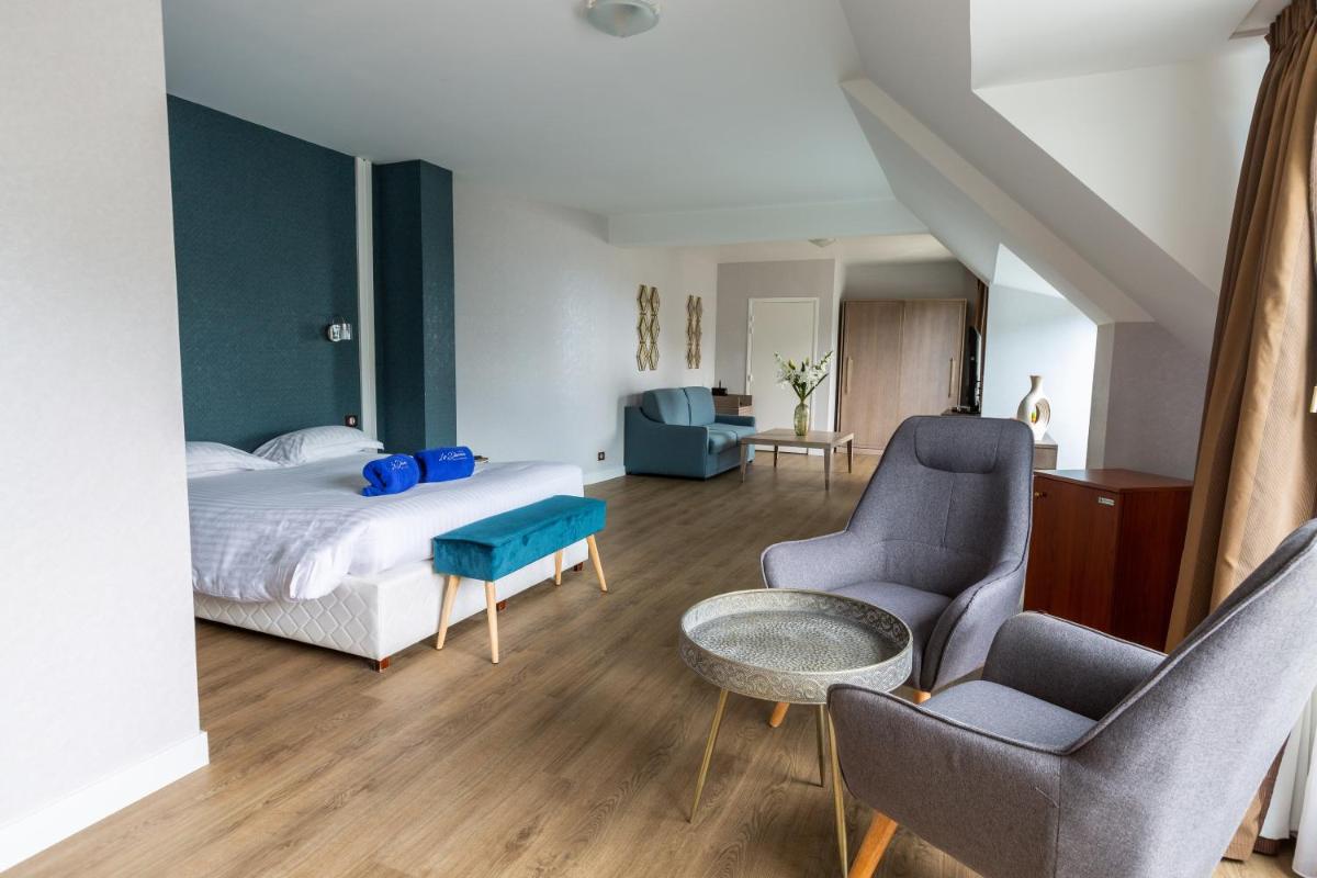 Coin salon dans l'établissement Le Diana Hôtel & Spa