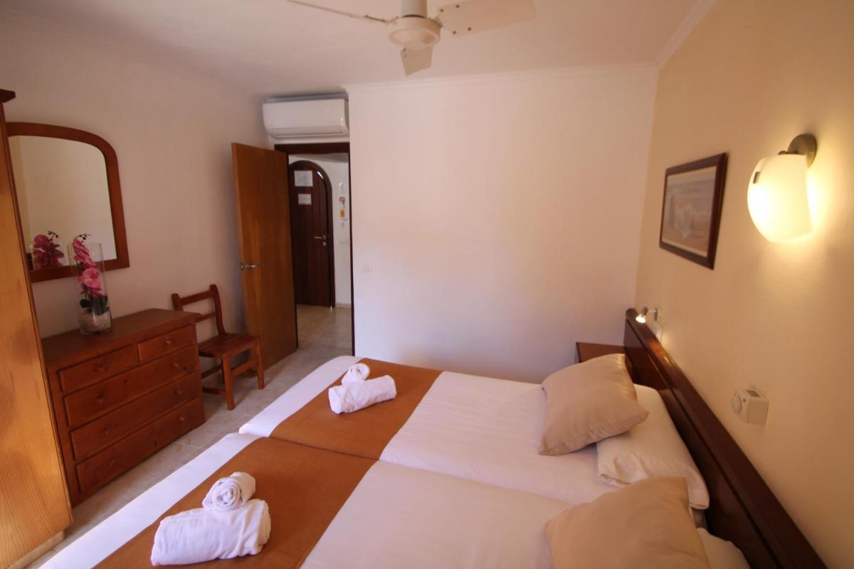 Cama o camas de una habitación en Apartaments Talayot