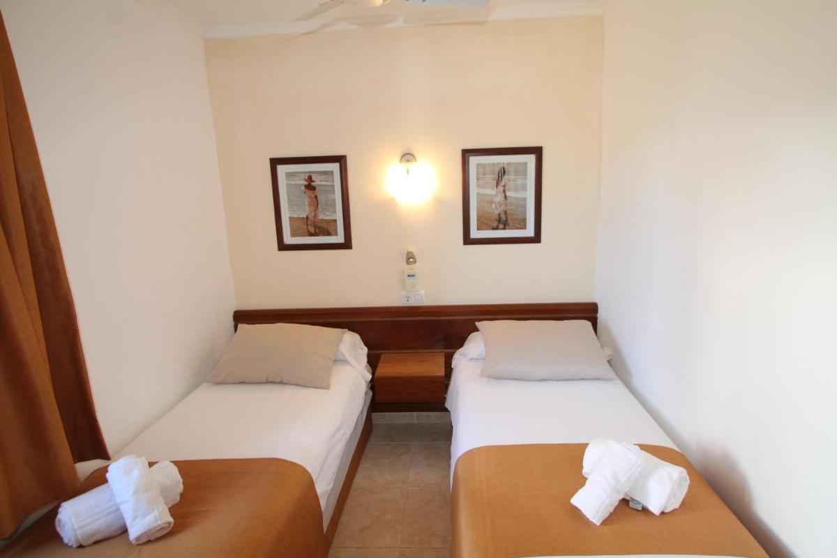 Cama o camas de una habitación en Apartaments Talayot