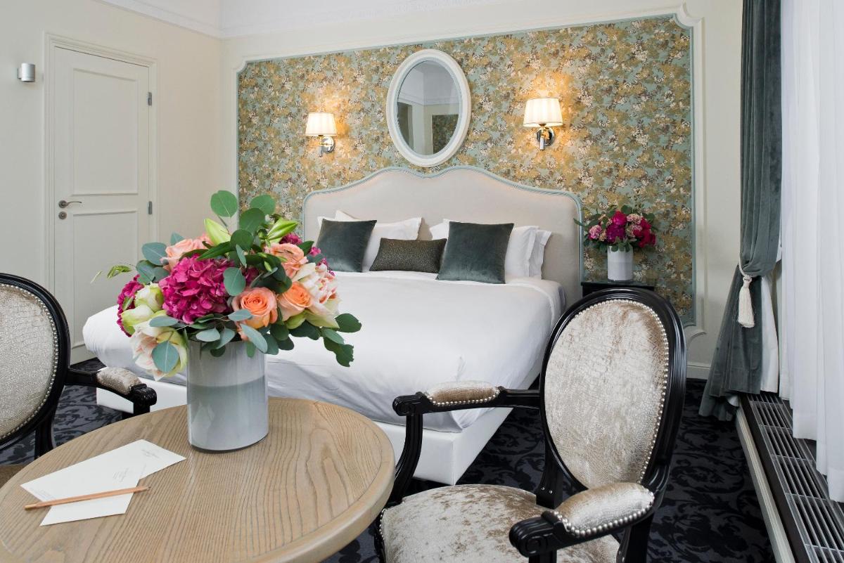 Un ou plusieurs lits dans un hébergement de l'établissement Hôtel Saint-Pétersbourg Opéra & Spa
