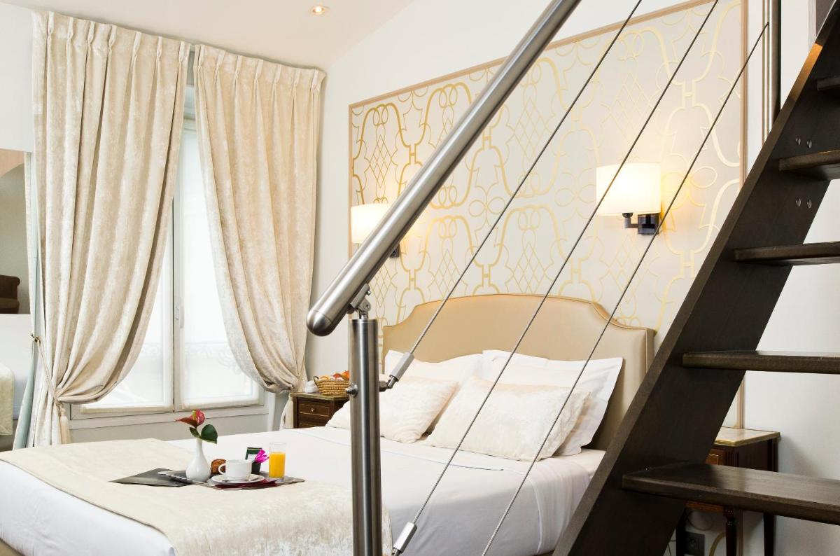 Un ou plusieurs lits dans un hébergement de l'établissement Hôtel Saint-Pétersbourg Opéra & Spa