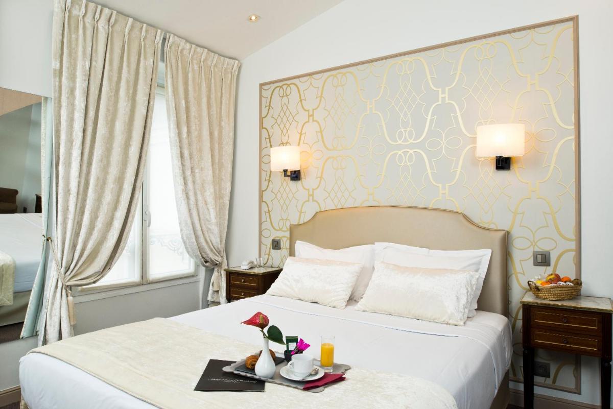 Un ou plusieurs lits dans un hébergement de l'établissement Hôtel Saint-Pétersbourg Opéra & Spa